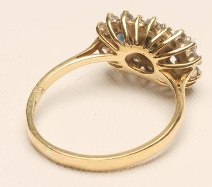 A SAPPHIRE AND DIAMOND TRIPLE CLUSTER RING Image