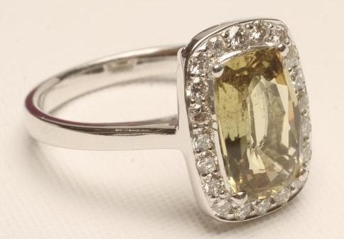 A YELLOW SAPPHIRE AND DIAMOND RING Image