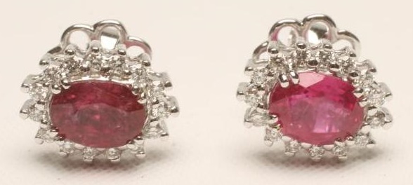 A PAIR OF RUBY AND DIAMOND CLUSTER EAR STUDS Image