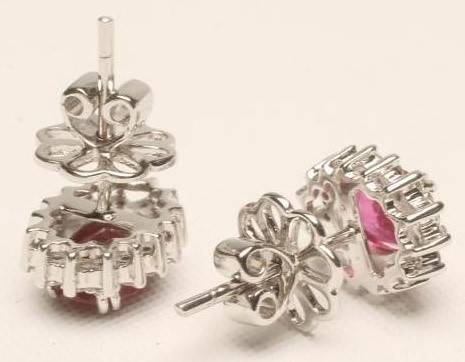 A PAIR OF RUBY AND DIAMOND CLUSTER EAR STUDS Image
