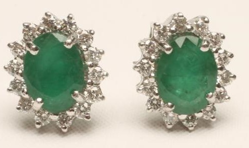 A PAIR OF EMERALD AND DIAMOND CLUSTER EAR STUDS Image