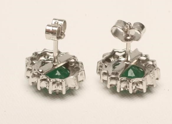 A PAIR OF EMERALD AND DIAMOND CLUSTER EAR STUDS Image