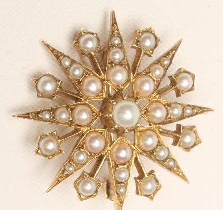 A LATE VICTORIAN STAR BROOCH/PENDANT set with split seed pearls (Est. plus 18% premium inc. VAT) Image