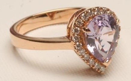 A PINK SAPPHIRE AND DIAMOND CLUSTER RING Image