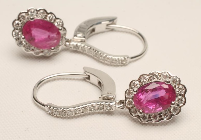 A PAIR OF RUBY AND DIAMOND CLUSTER EARRINGS Image