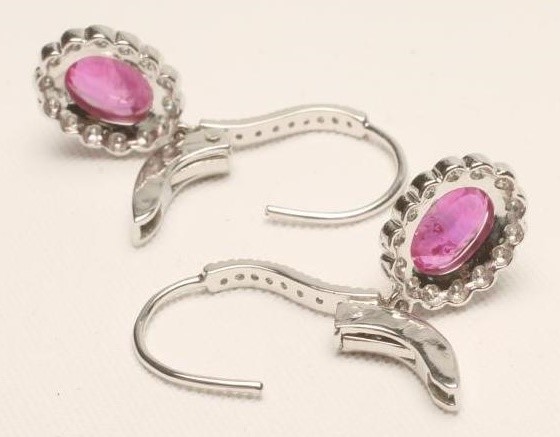 A PAIR OF RUBY AND DIAMOND CLUSTER EARRINGS Image