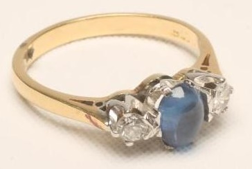 A SAPPHIRE AND DIAMOND THREE STONE RING Image