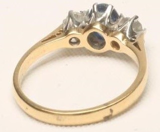 A SAPPHIRE AND DIAMOND THREE STONE RING Image