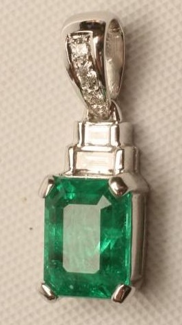 AN EMERALD AND DIAMOND PENDANT Image