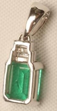 AN EMERALD AND DIAMOND PENDANT Image
