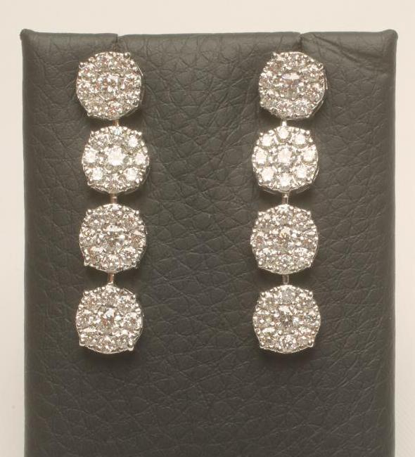 A PAIR OF DIAMOND CLUSTER DROP EAR STUDS Image