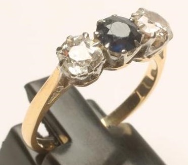 A SAPPHIRE AND DIAMOND THREE STONE RING Image