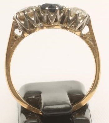 A SAPPHIRE AND DIAMOND THREE STONE RING Image