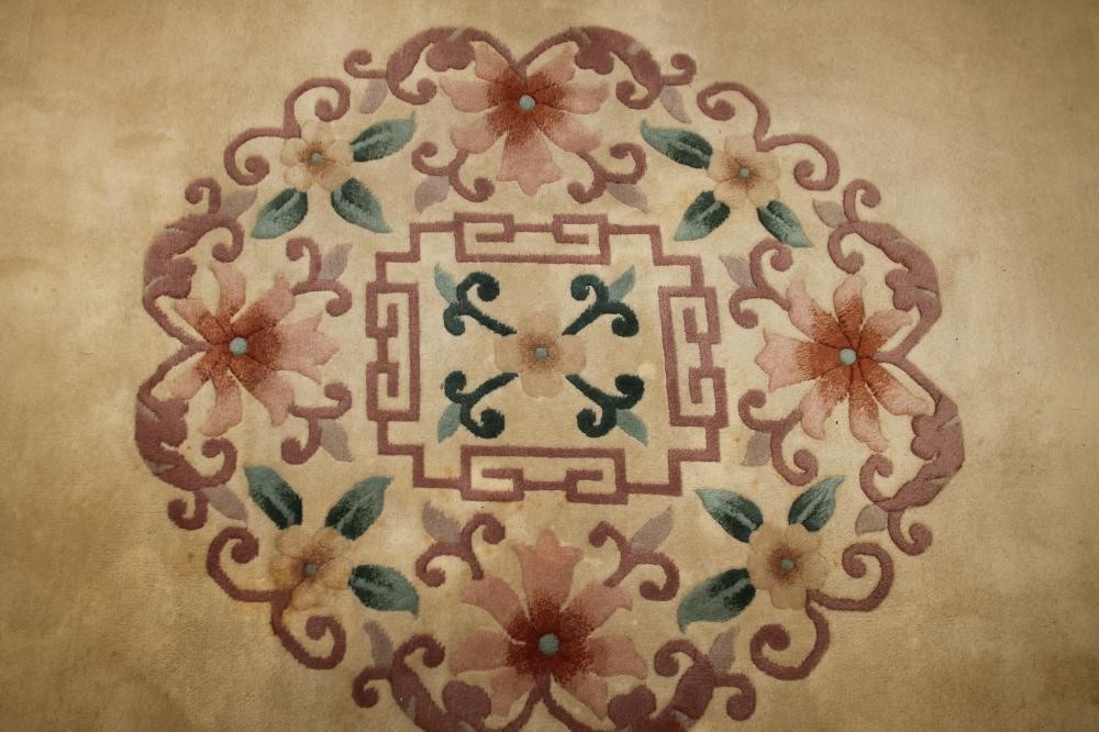 A CHINESE WASHED AND FRINGED CARPET Image