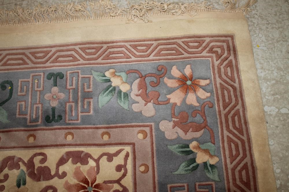 A CHINESE WASHED AND FRINGED CARPET Image