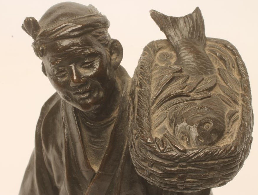 A JAPANESE BRONZE FIGURE Image