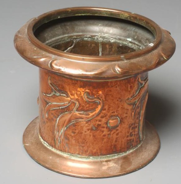 AN ARTS AND CRAFTS COPPER JARDINIERE of cylindrical form with flared leaf embossed rim Image