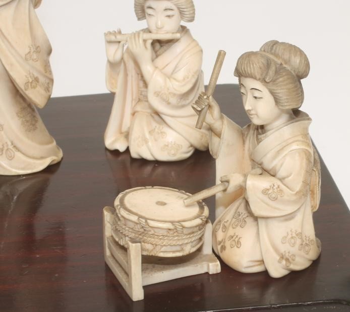 A COLLECTION OF JAPANESE IVORY FEMALE MUSICIANS AND FAN DANCER Image