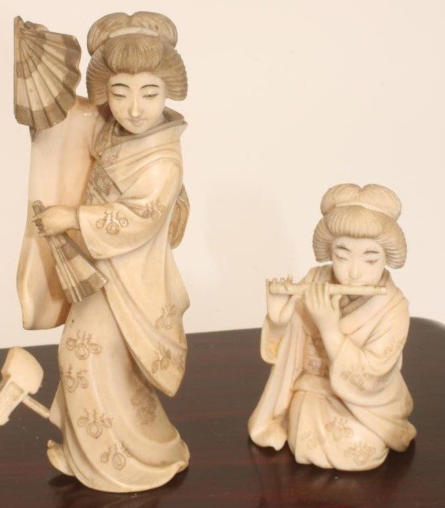 A COLLECTION OF JAPANESE IVORY FEMALE MUSICIANS AND FAN DANCER Image
