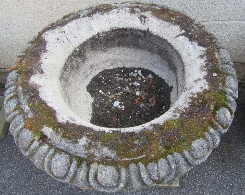 A COMPOSITION STONE URN with ovolo moulded rim Image