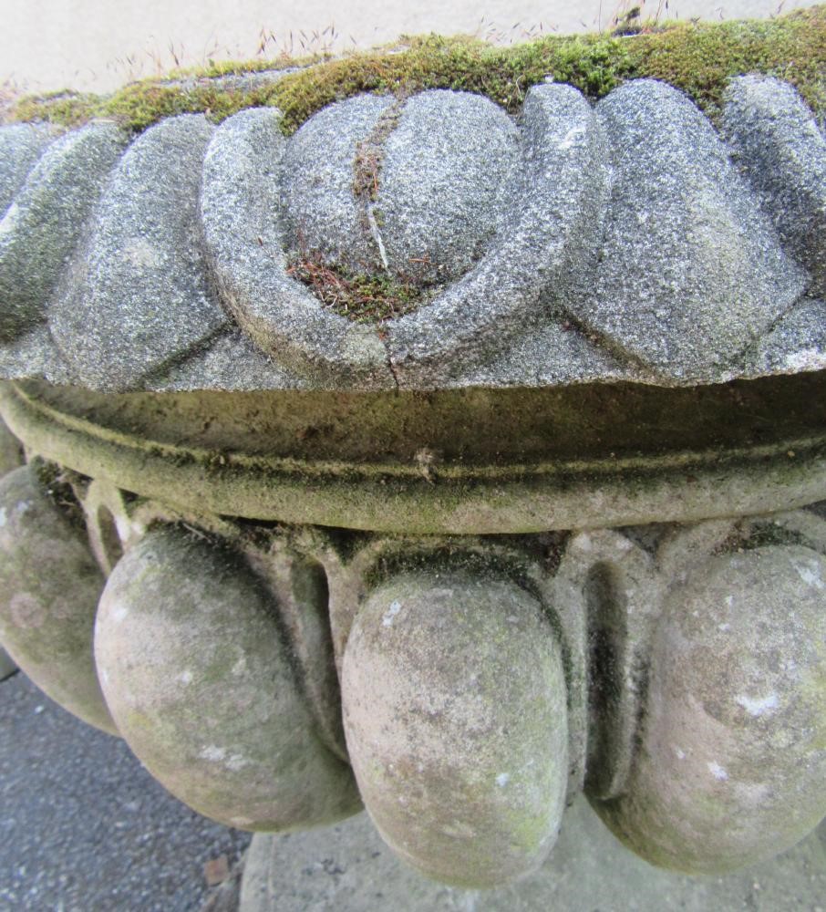 A COMPOSITION STONE URN with ovolo moulded rim Image