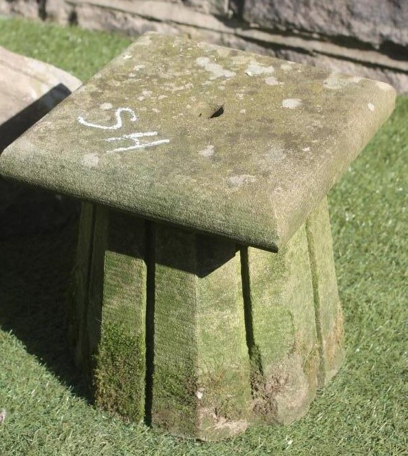 A SANDSTONE SUNDIAL of domed square form with copper dial Image