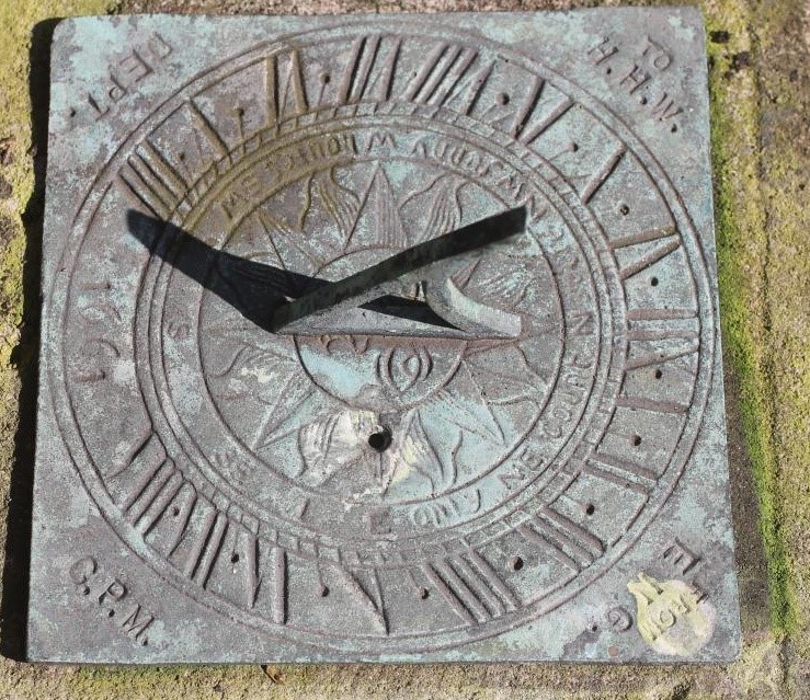 A SANDSTONE SUNDIAL of domed square form with copper dial Image
