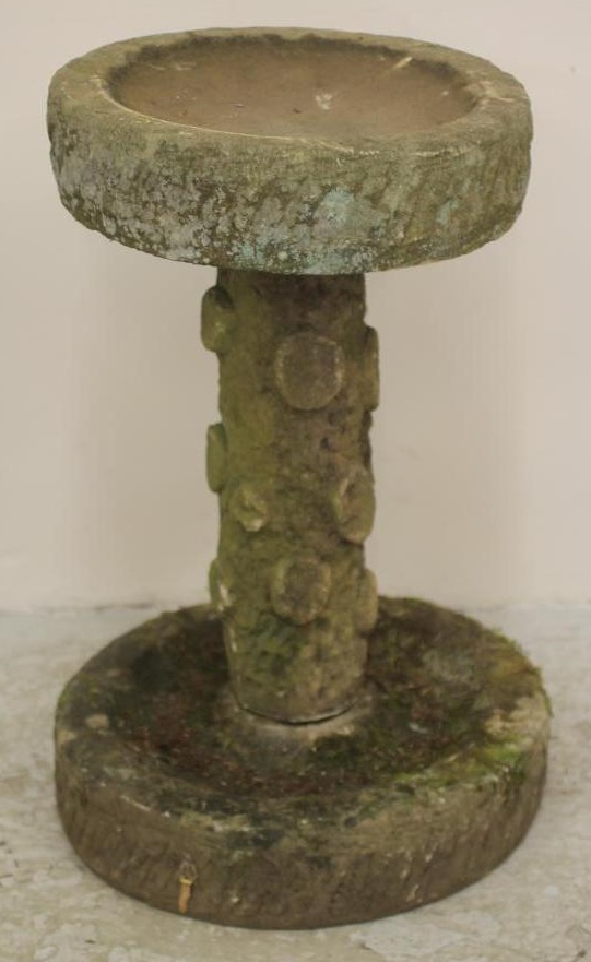 A SANDSTONE BIRD BATH of rough hewn circular form Image