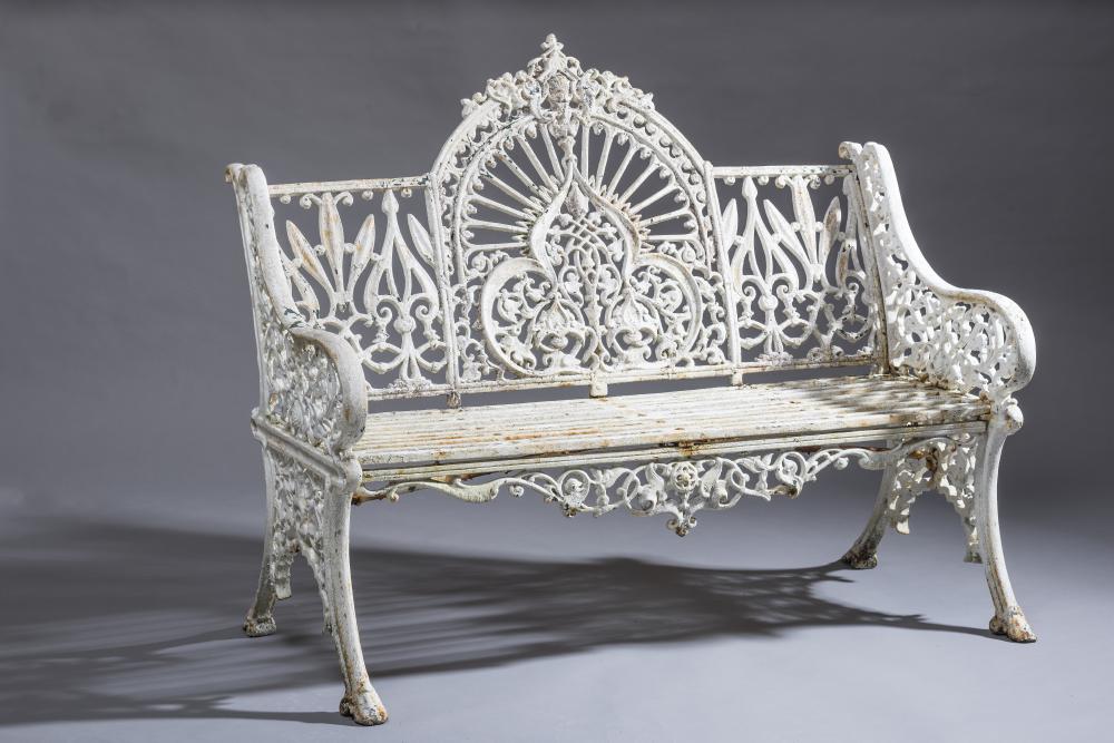 A VICTORIAN CAST IRON GARDEN SEAT modelled in an Eastern style pattern Image