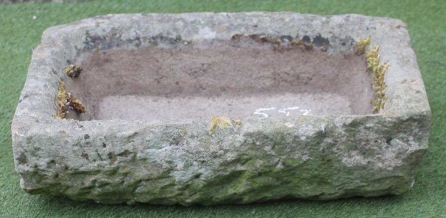 A SANDSTONE TROUGH of oblong form with mildly inward sloping sides Image