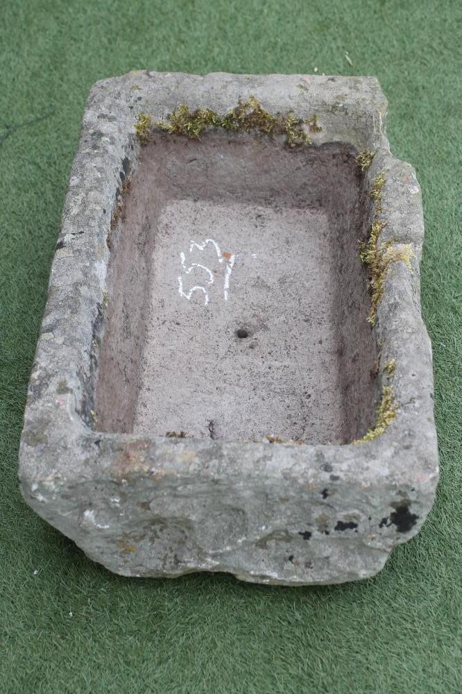 A SANDSTONE TROUGH of oblong form with mildly inward sloping sides Image