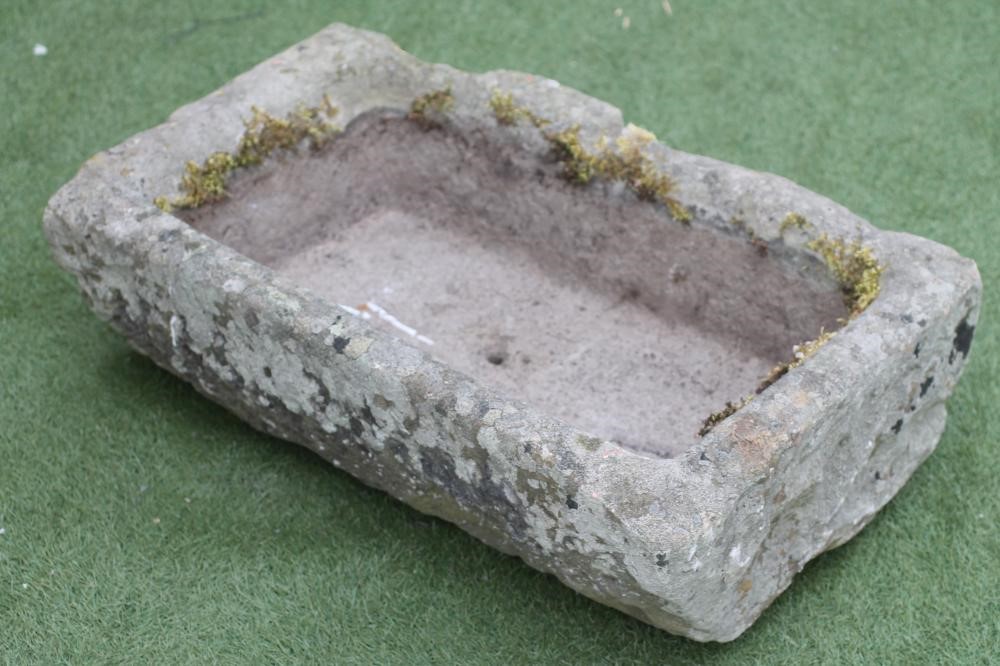 A SANDSTONE TROUGH of oblong form with mildly inward sloping sides Image