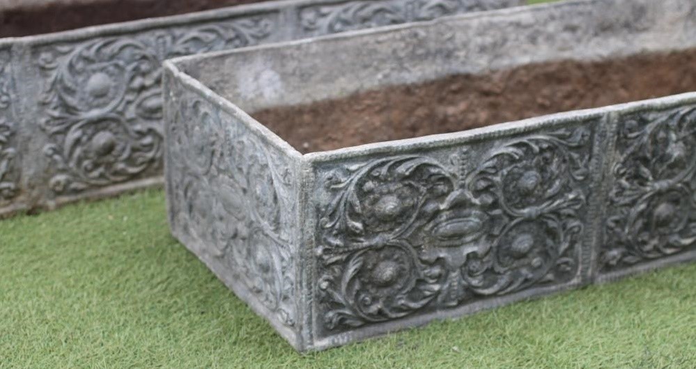 A PAIR OF LEAD PLANTERS Image