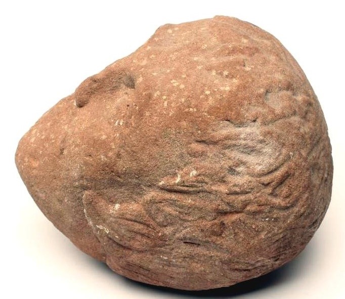 A CARVED RED SANDSTONE HEAD OF A YOUNG MAN Image
