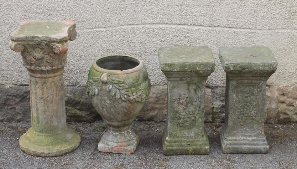 A VICTORIAN TERRACOTTA URN of ovoid form with floral swags suspended from lug handles Image