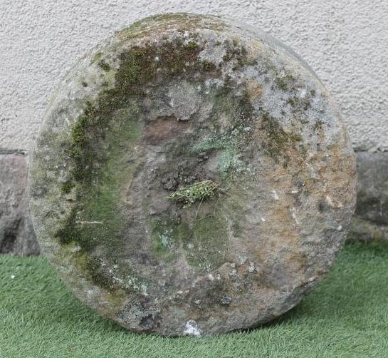 A SMALL SANDSTONE MILL WHEEL Image