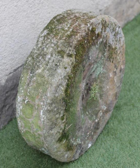 A SMALL SANDSTONE MILL WHEEL Image