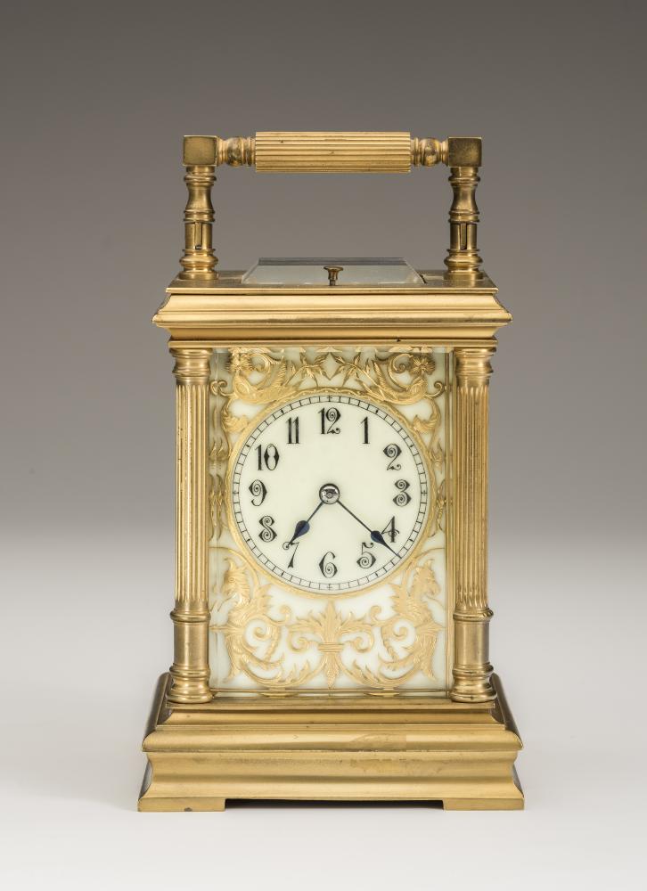A BRASS CASED STRIKING AND REPEATER CARRIAGE CLOCK Image
