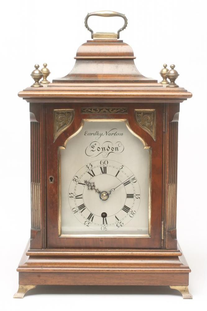 A MAHOGANY CASED TABLE CLOCK by Eardley Norton Image