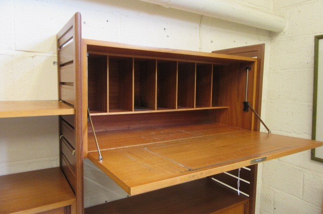 A STAPLES TEAK LADDERAX ROOM UNIT comprising three wooden ladders supporting a cupboard with sliding Image