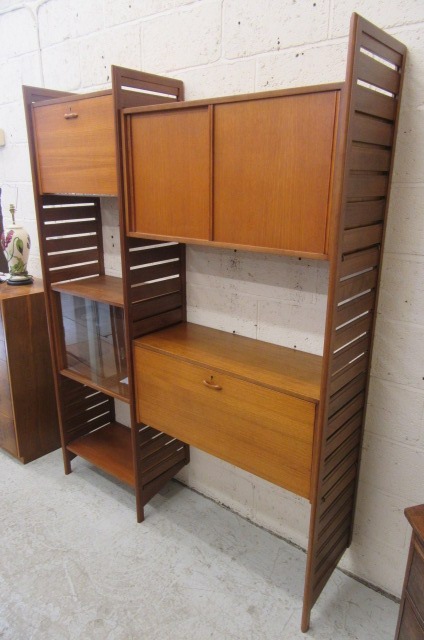 A STAPLES TEAK LADDERAX ROOM UNIT comprising three wooden ladders Image
