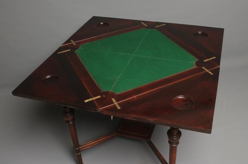 A LATE VICTORIAN ROSEWOOD ENVELOPE CARD TABLE of usual form with stringing Image