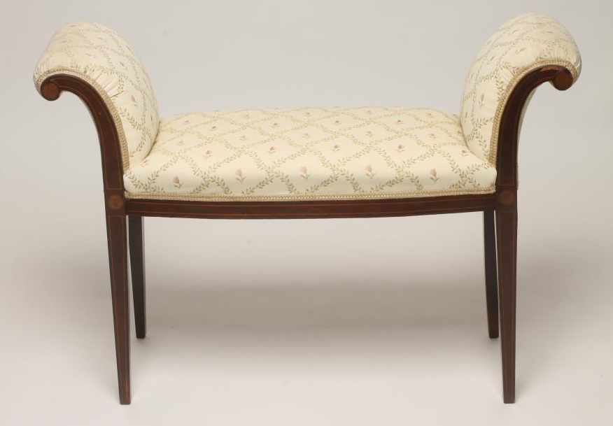 AN EDWARDIAN MAHOGANY WINDOW SEAT of mildly bowed form with stringing and marquetry roundels Image