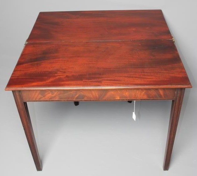 A GEORGIAN MAHOGANY FOLDING TEA TABLE Image