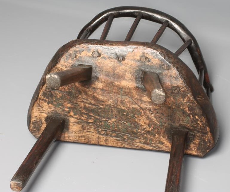 A PRIMITIVE ASH AND ELM STICK BACK ELBOW CHAIR with arched rustic top rail Image