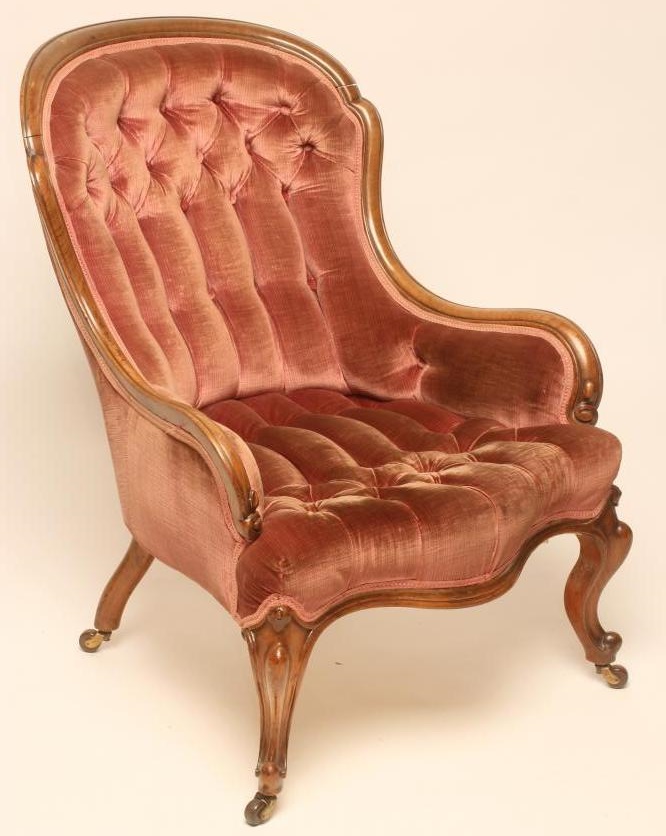A LADY'S VICTORIAN WALNUT FRAMED ARMCHAIR of low spoonback form button upholstered in pink velvet Image
