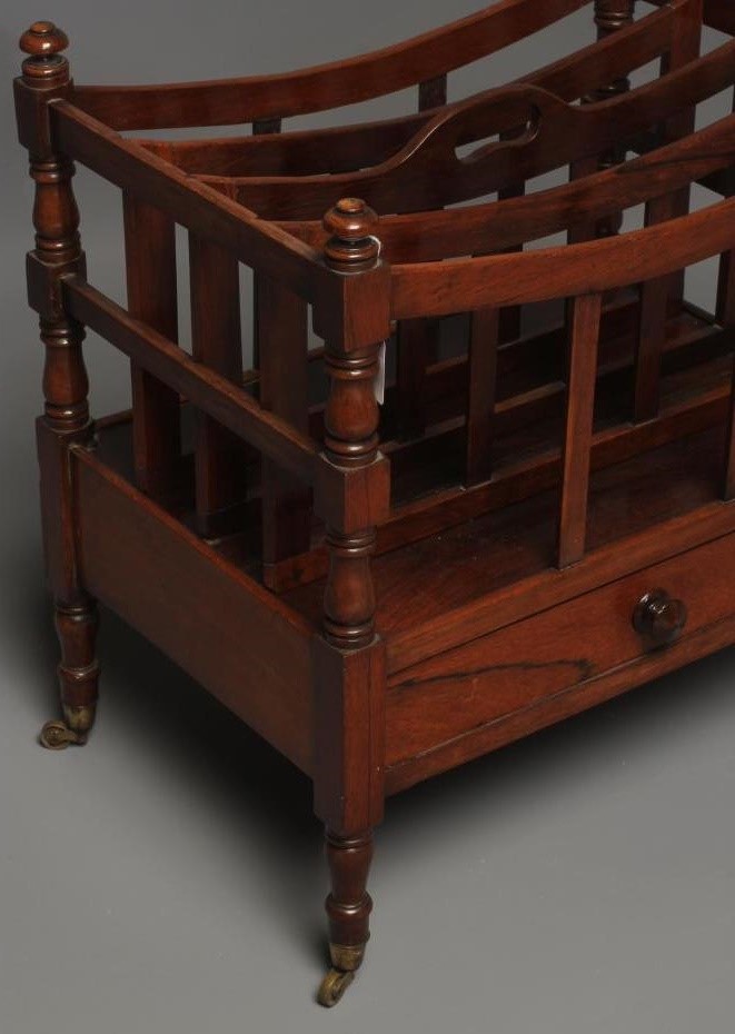 A GEORGE IV ROSEWOOD CANTERBURY of oblong form with dished slatted divisions Image