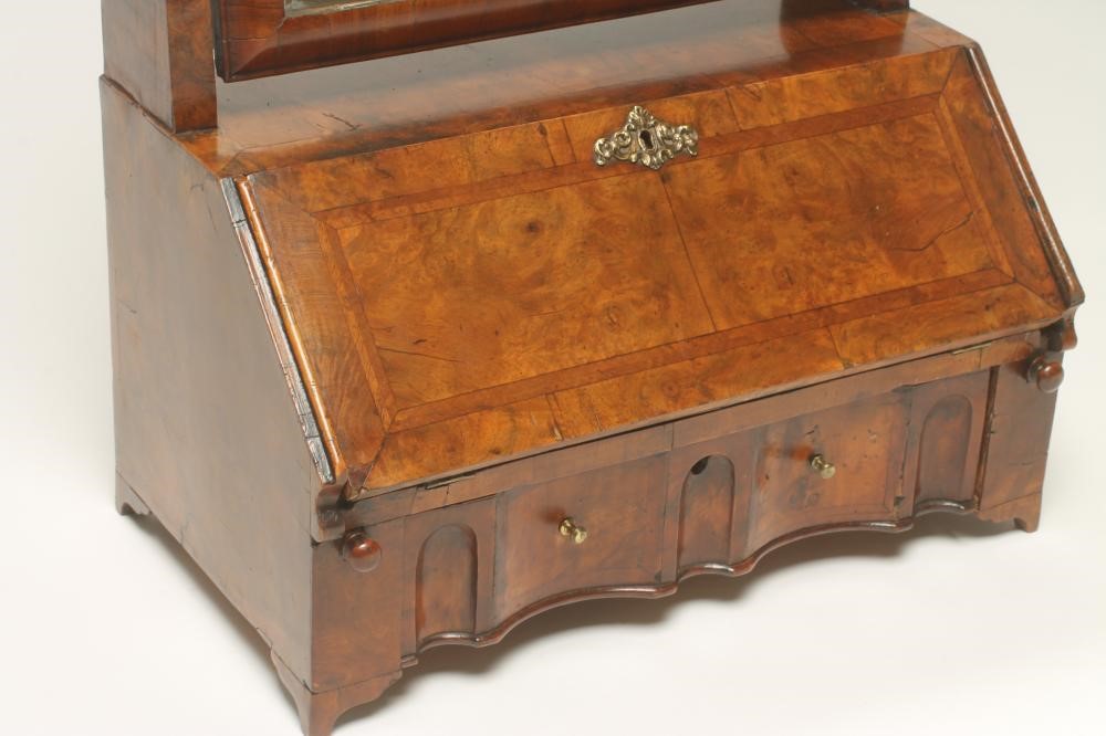 AN EARLY GEORGIAN AND LATER WALNUT TOILET MIRROR Image