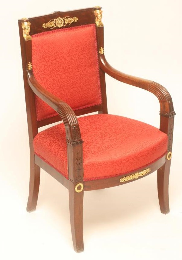 A FRENCH EMPIRE MAHOGANY ARMCHAIR with gilt metal mounts upholstered in red silk Image