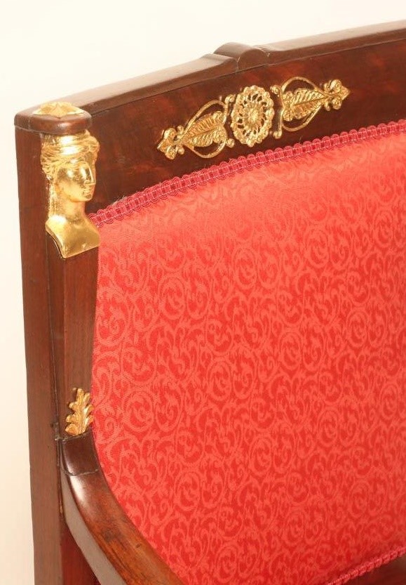 A FRENCH EMPIRE MAHOGANY ARMCHAIR with gilt metal mounts upholstered in red silk Image